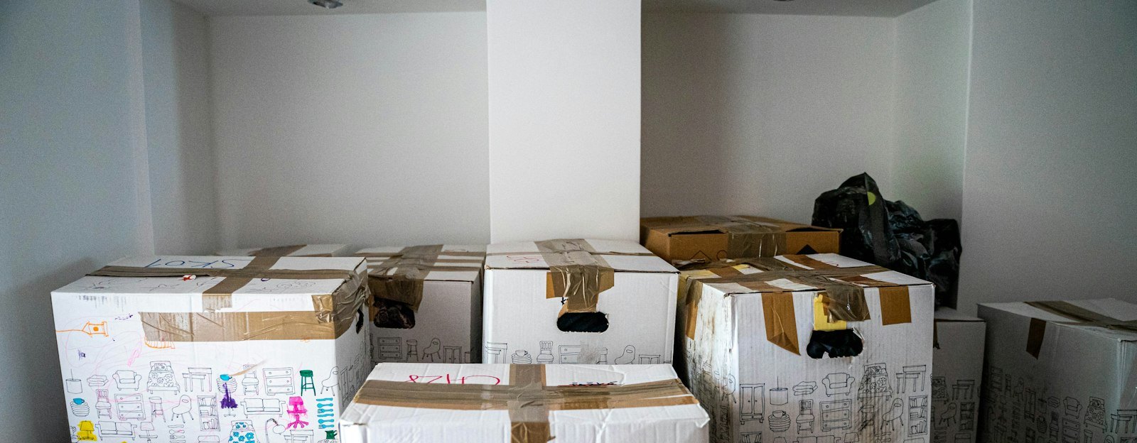 Brown cardboard boxes on wooden table