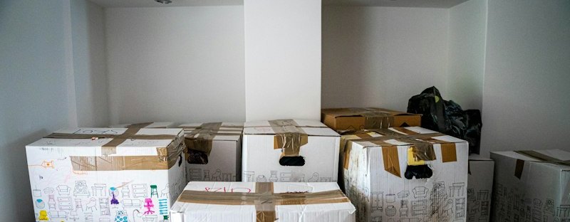 Brown cardboard boxes on wooden table